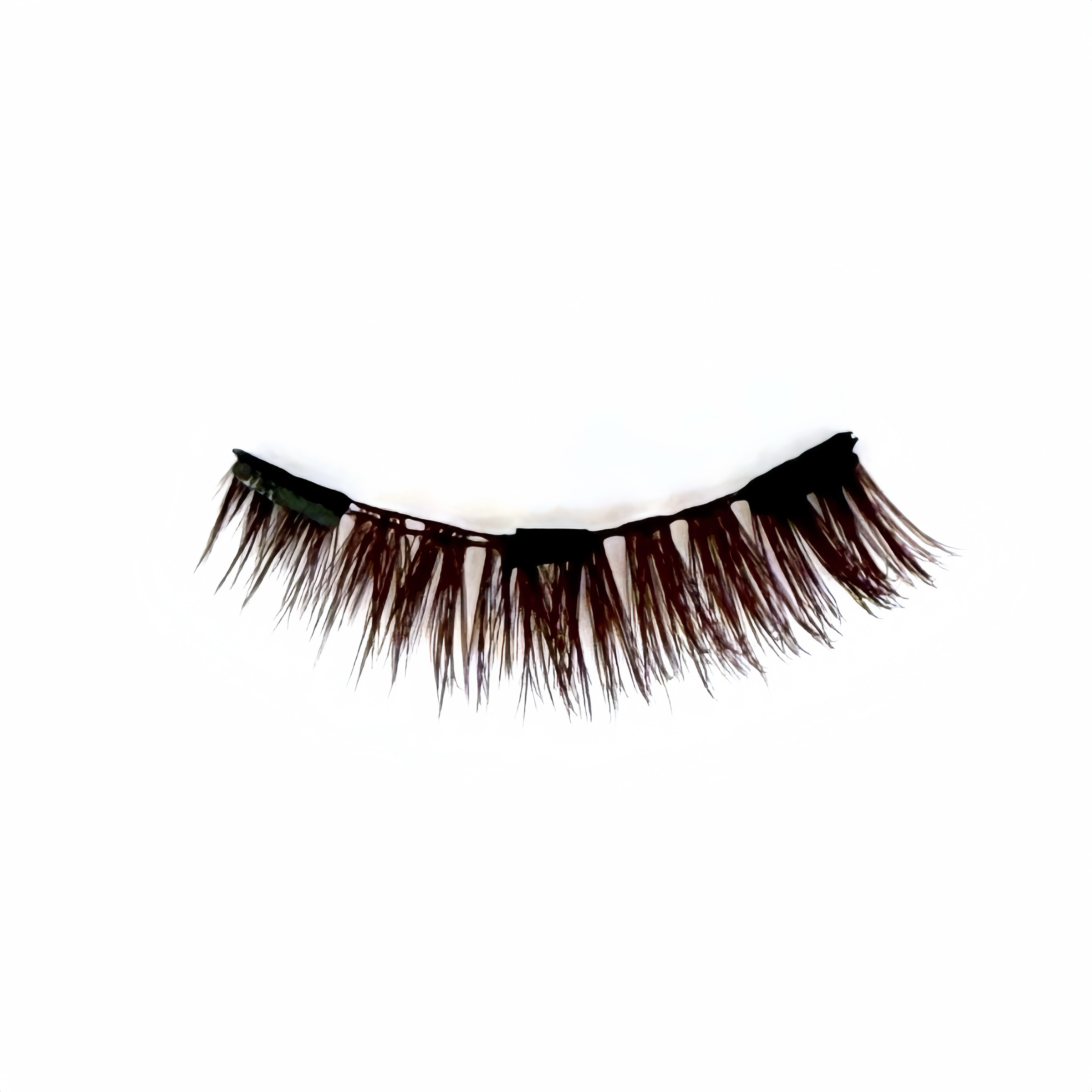 Pair of natural, brown cat-eye false eyelashes on a white background